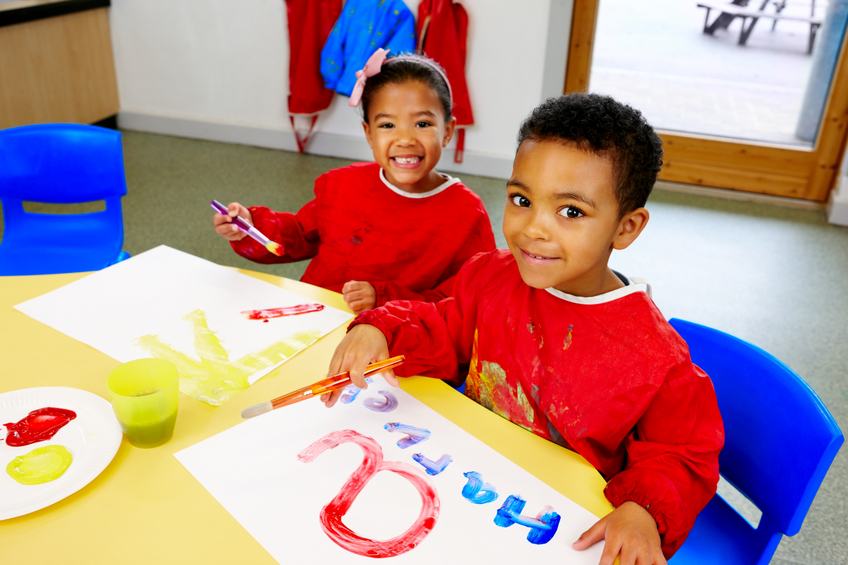 Preschool children doing craft activities at kindergarten